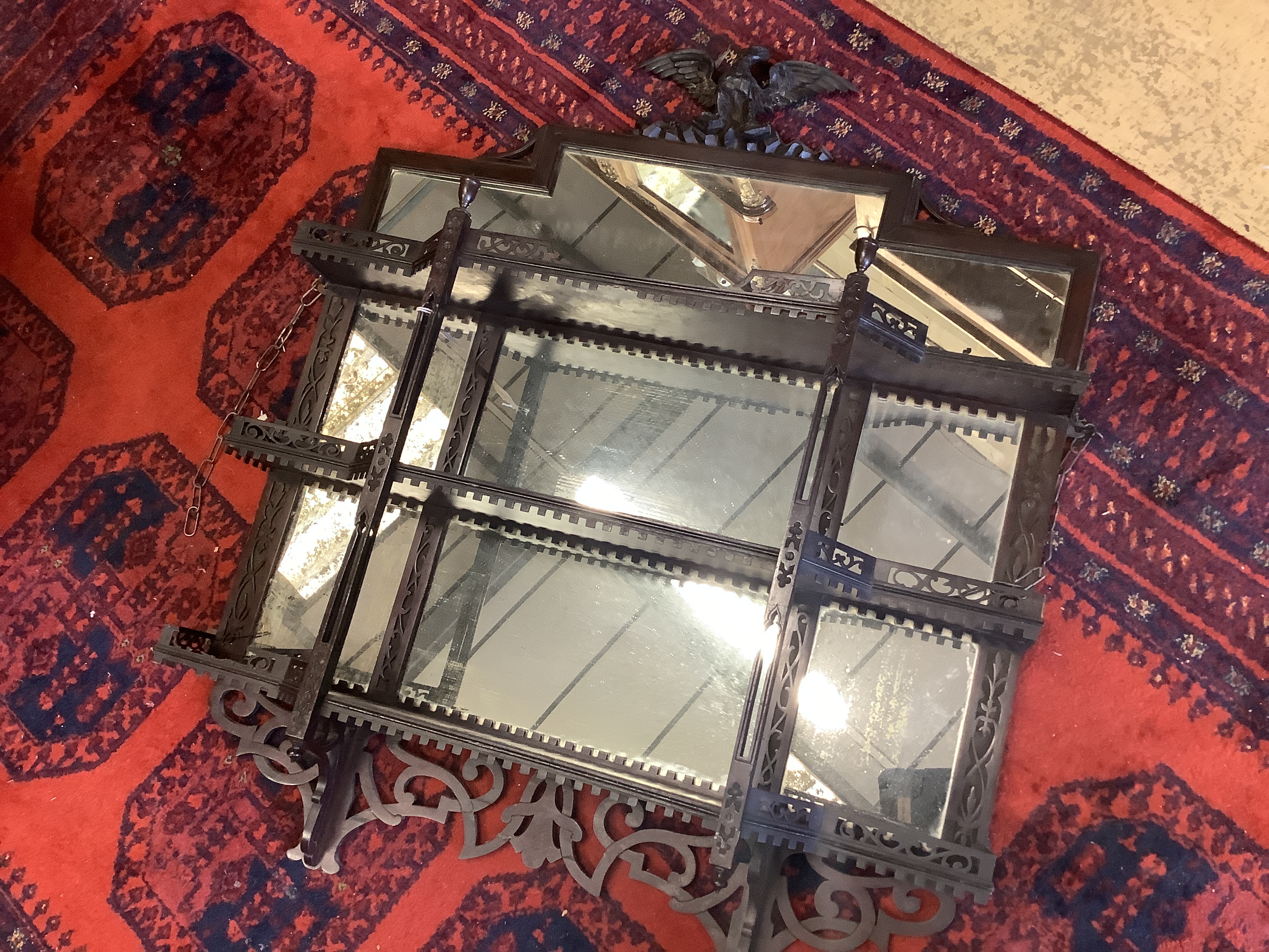 A Victorian mahogany mirrored three tier wall bracket, width 91cm, depth 18cm, height 106cm